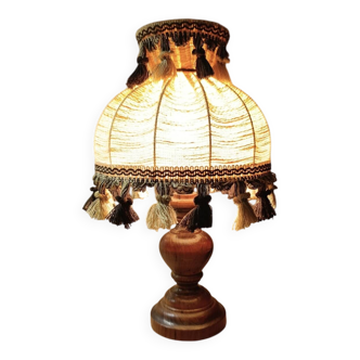 Wood bedside lamp with dome shade in granny chic style.