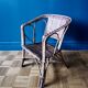Small child vintage armchair in rattan