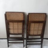 Pair of folding chairs in cane and dark wood