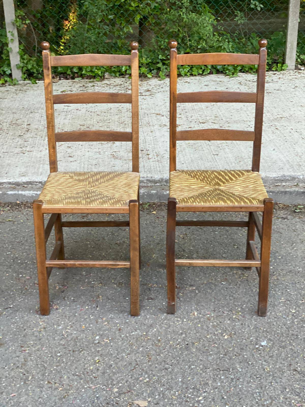 2 solid wood and straw chairs