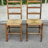 2 solid wood and straw chairs