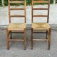 2 solid wood and straw chairs