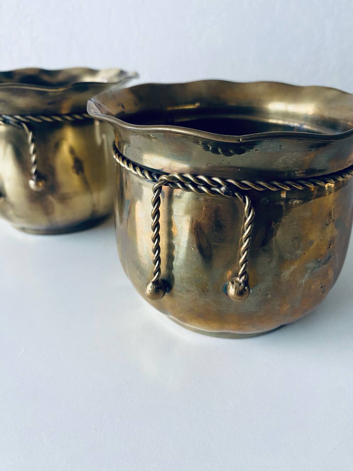 Pair of brass cord pot covers