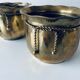 Pair of brass cord pot covers