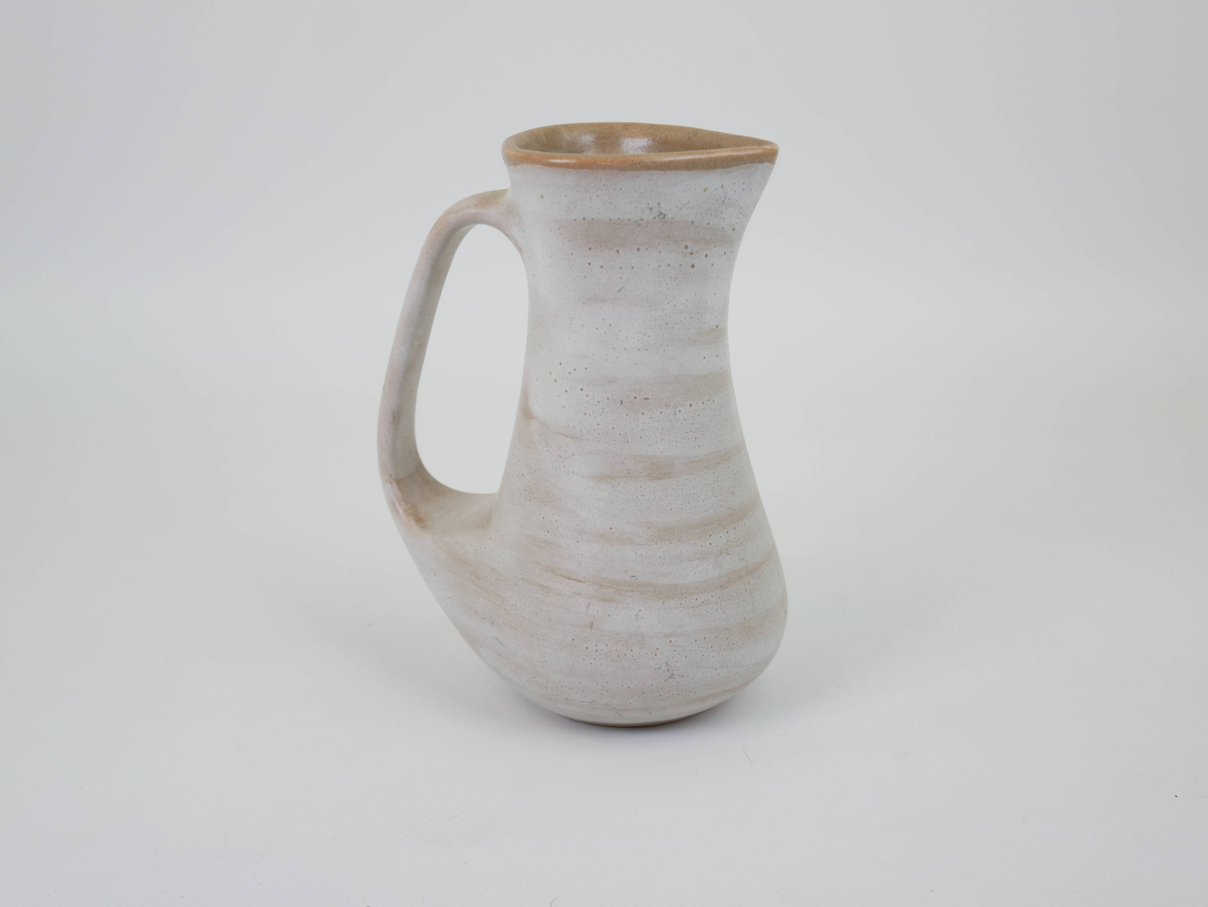 Signed white beige ceramic pitcher