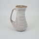Signed white beige ceramic pitcher