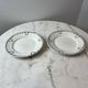 Set of 2 Saint Amand plates with laurel crown decoration.