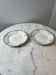 Set of 2 Saint Amand plates with laurel crown decoration.