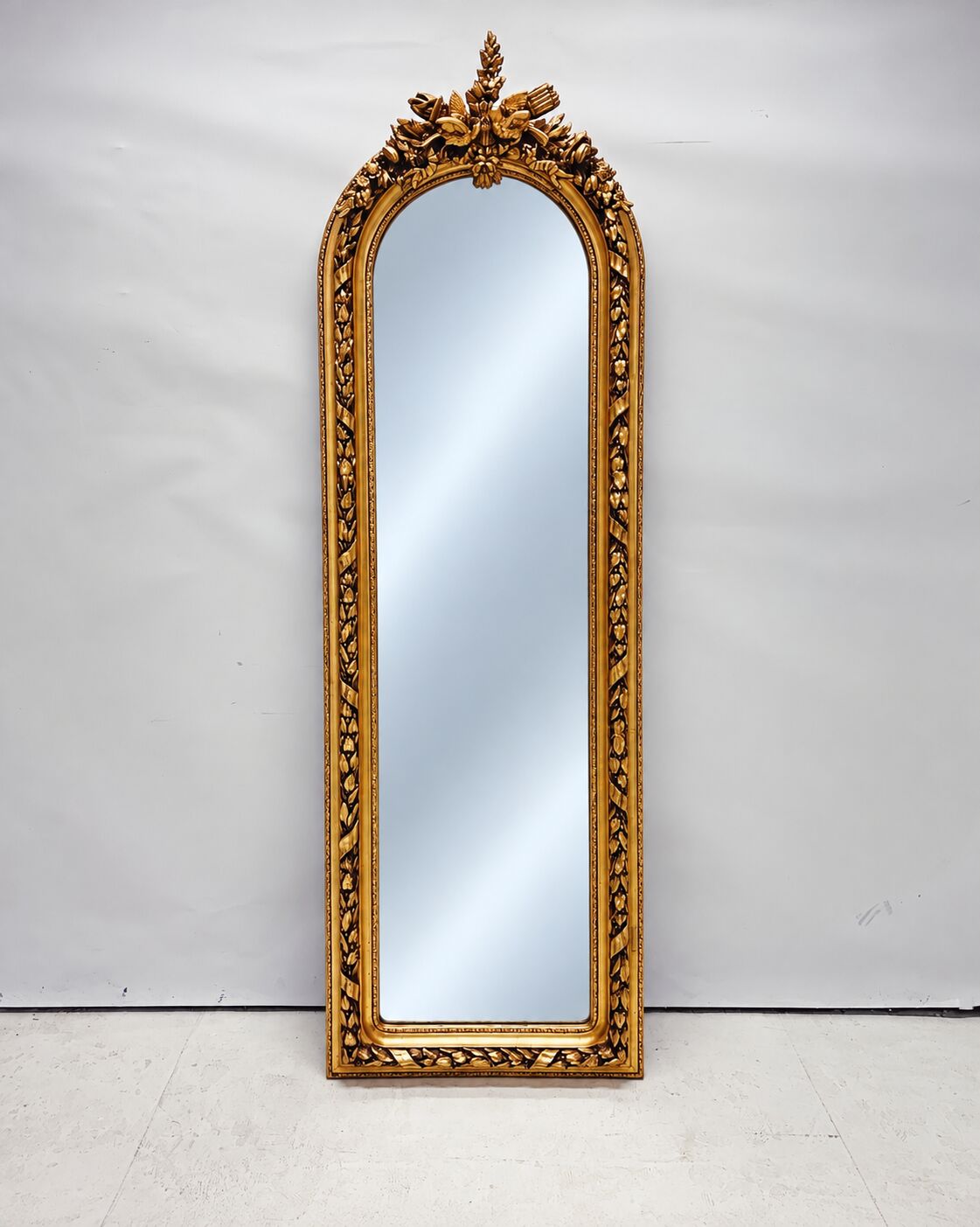 Large gold full-length mirror with ornate crest