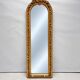 Large gold full-length mirror with ornate crest