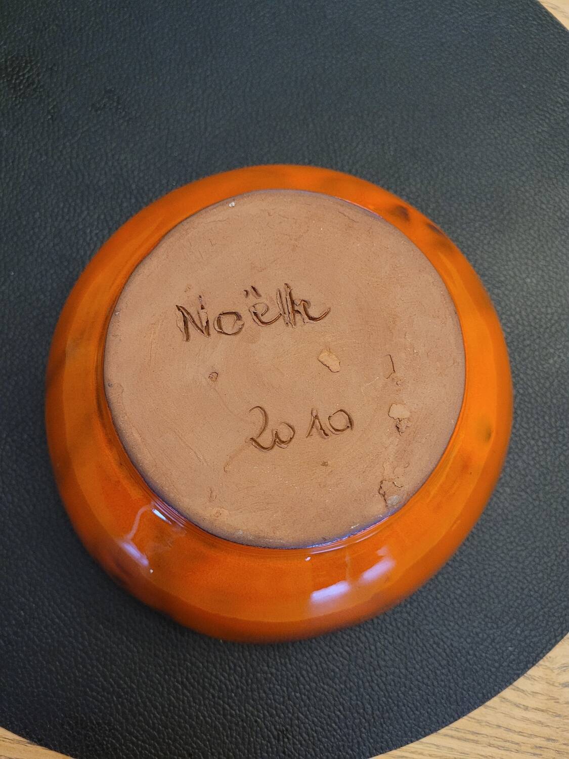 Orange ceramic star-shaped empty bowl