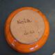 Orange ceramic star-shaped empty bowl