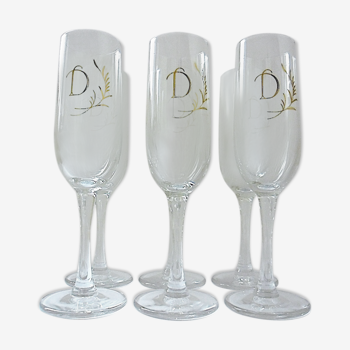 Suite of six "D" monogrammed champagne flutes