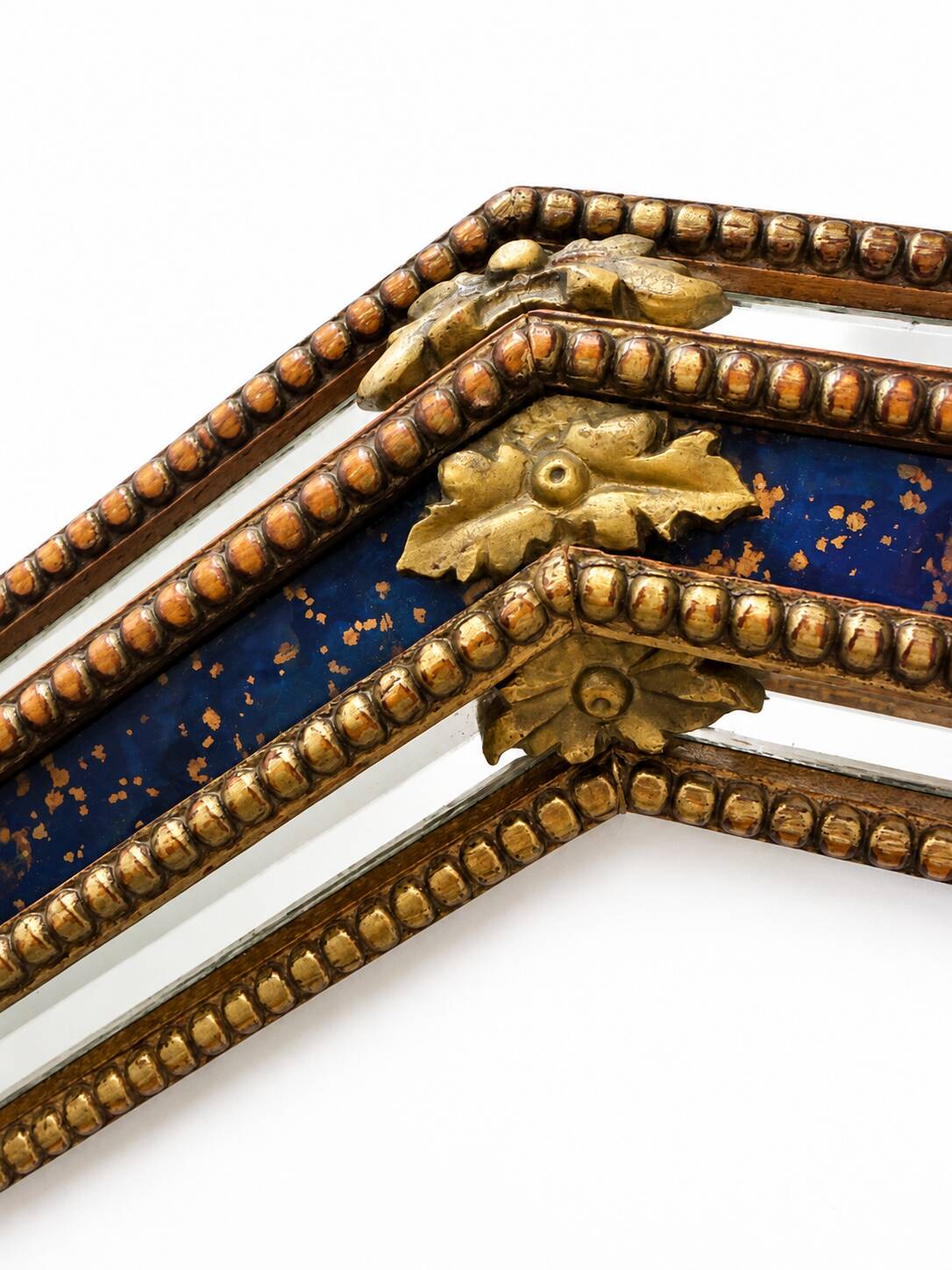 Octagonal wall mirror in cobalt blue eglomisé glass and gilded wood, Spain.