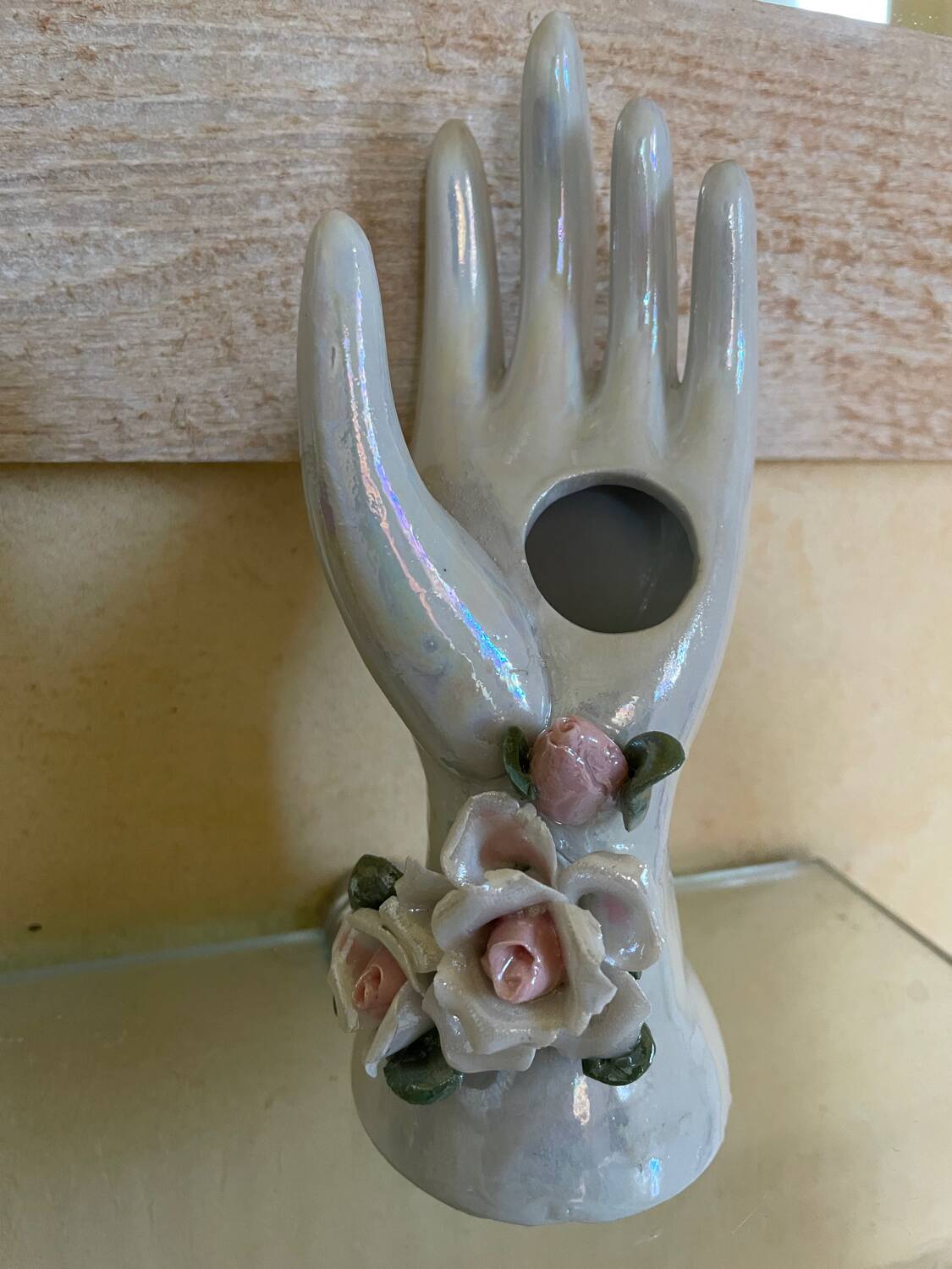 Hand holds jewelry or soliflore