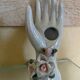 Hand holds jewelry or soliflore