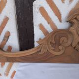 Old sandblasted wooden pediment