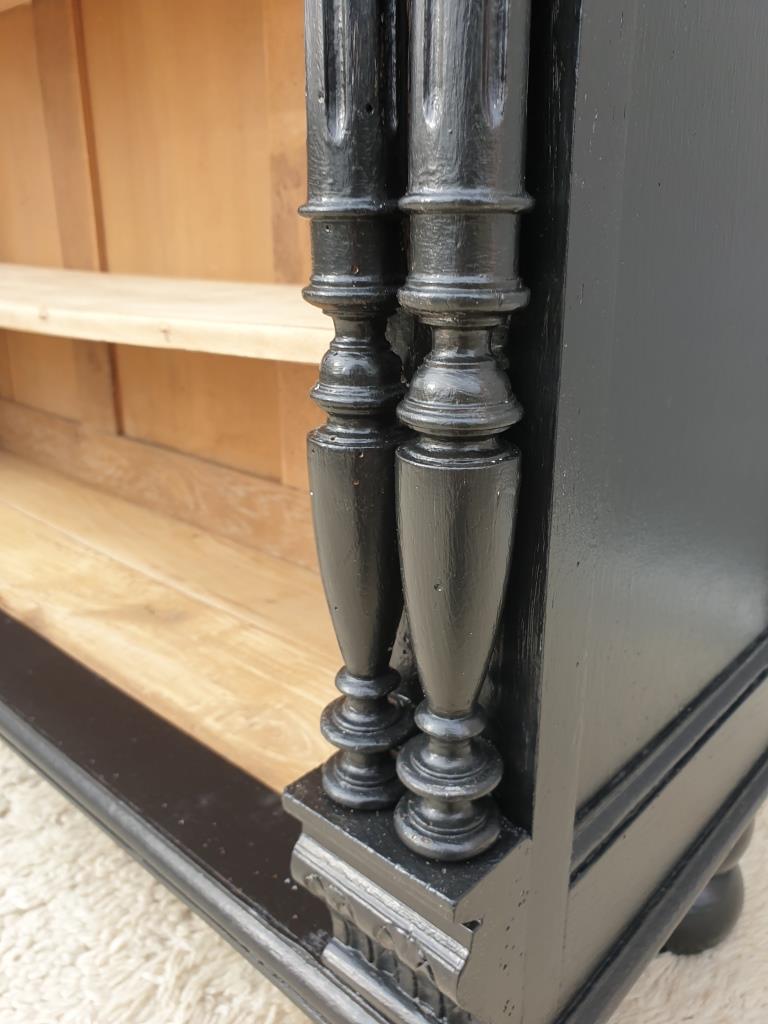 Neoclassical black wood bookcase with columns