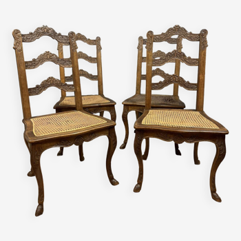 Série de quatre chaises Style Louis XV à fonds de canne en bois sculpté vers 1850