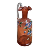 Antique blown glass bottle in pink with hand-painted floral decoration.