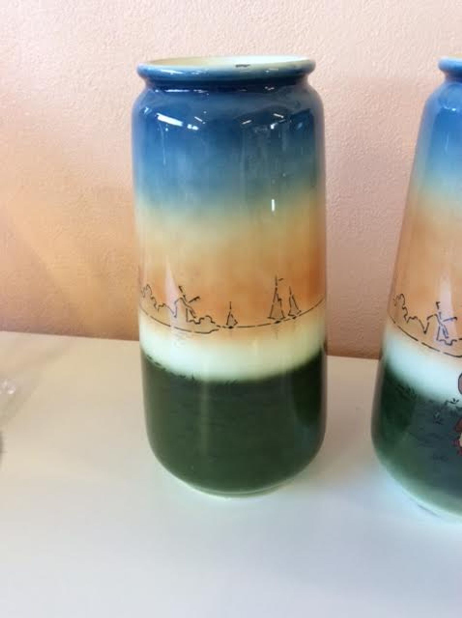 Pair of enamelled sandstone vases