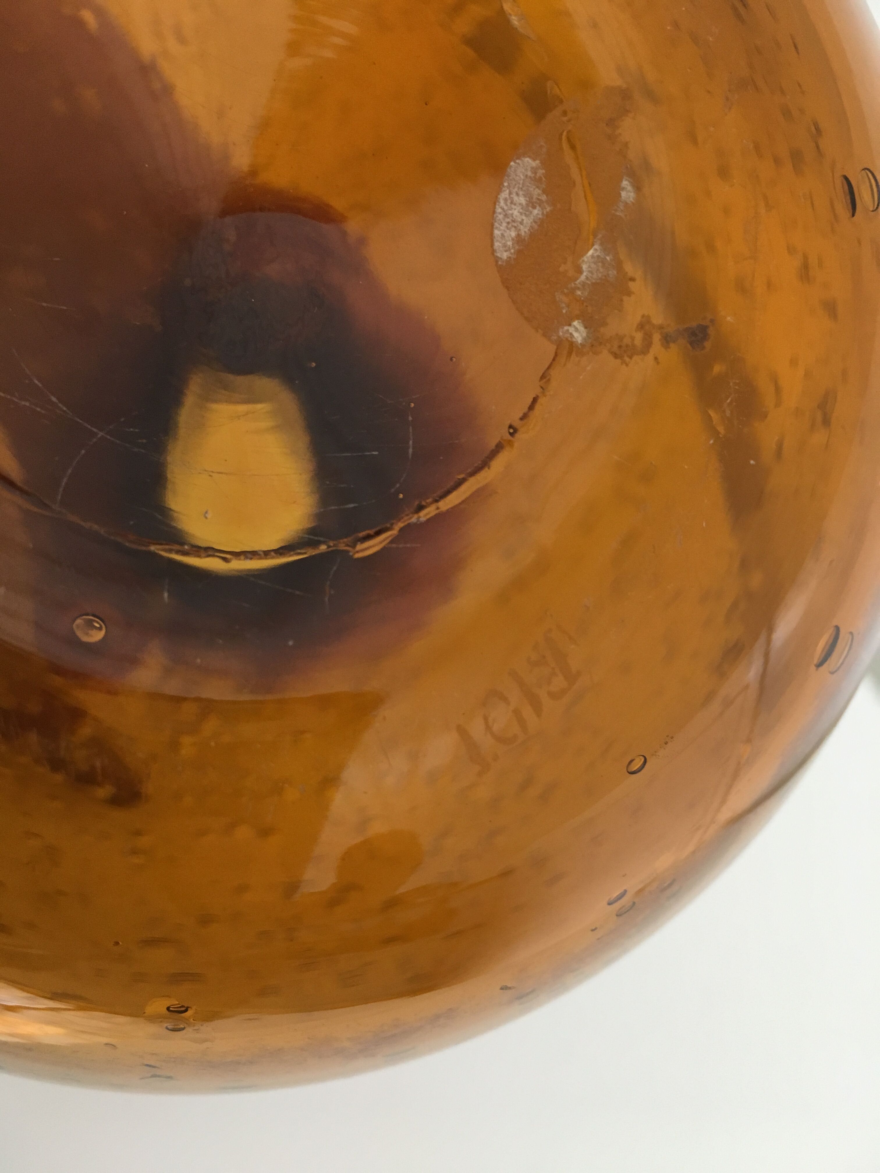 Biot blown glass amber bottle