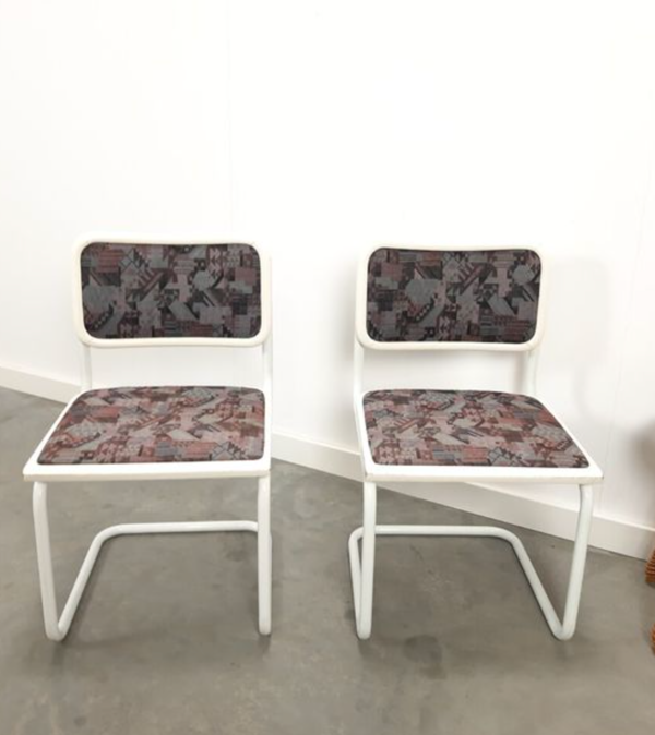 Pair of vintage tubular frame dining chairs