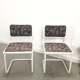 Pair of vintage tubular frame dining chairs