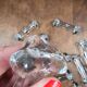 Set of 12 antique knife and fork rests in thick transparent glass.