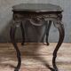 Antique desk in the Louis XV style, resting on four curved legs.