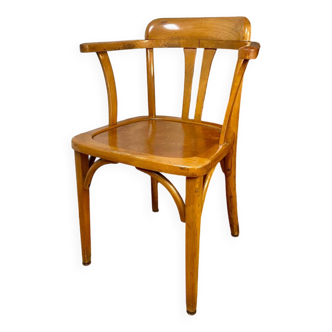 Antique curved wooden armchair in Baumann style