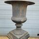 Large antique cast iron vases on pedestal