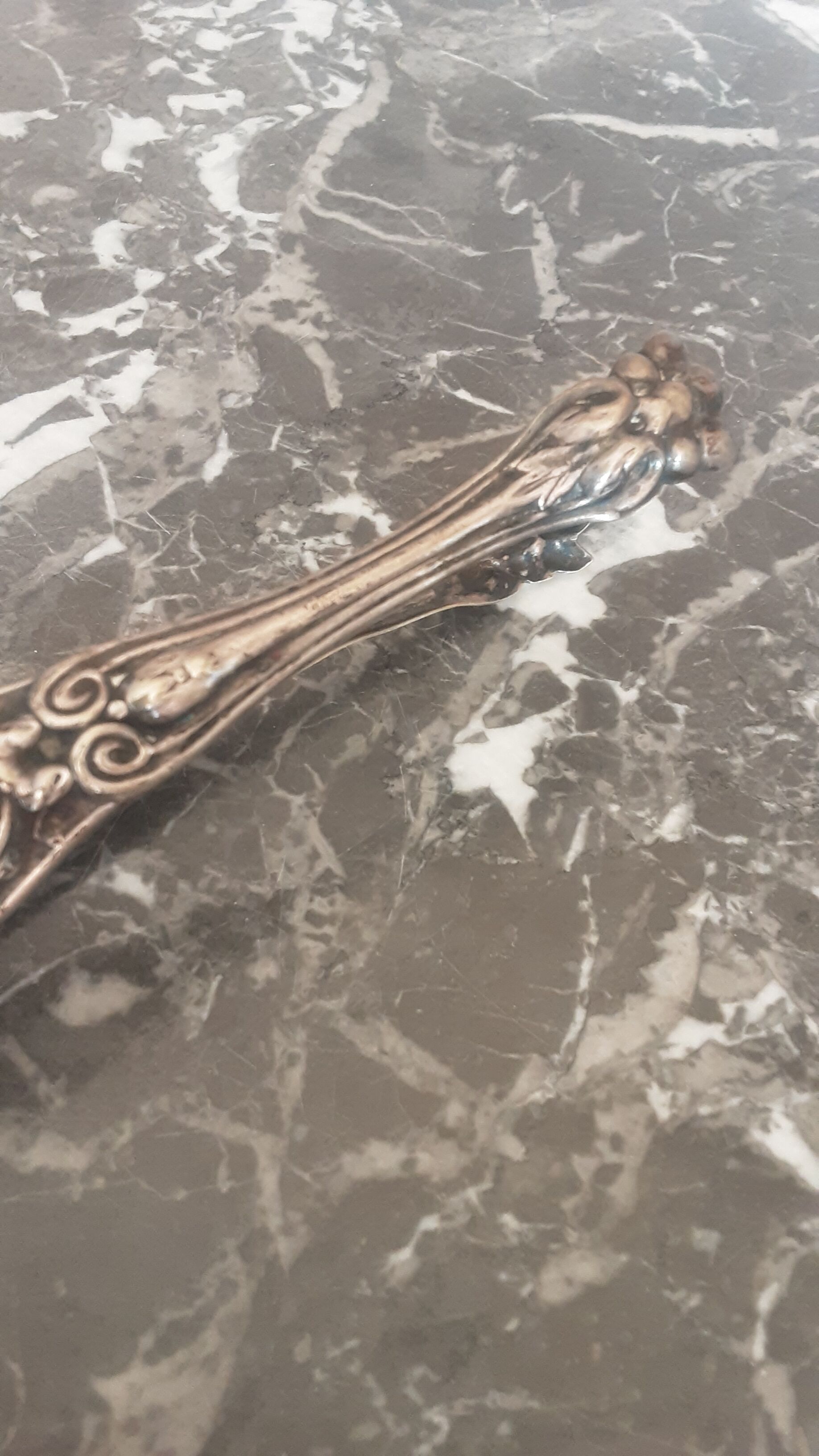 Antique silver metal sugar clamp