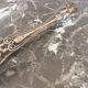Antique silver metal sugar clamp