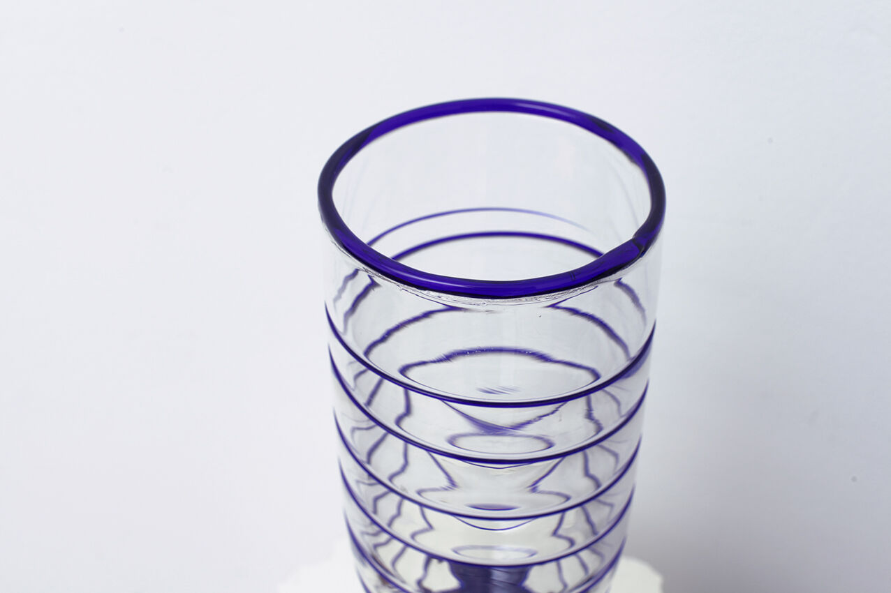 Transparent Murano glass vase and blue net