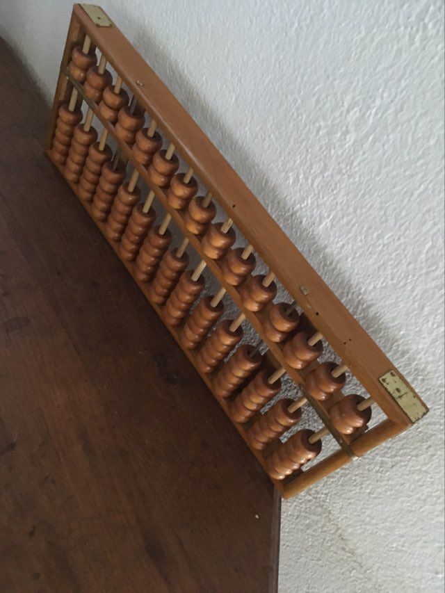 Vintage abacus made of light wood.
