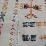 White kilim carpet with multicolored Berber patterns