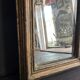 Miniature mirror from the 18th century in gilded wood, mercury glass.