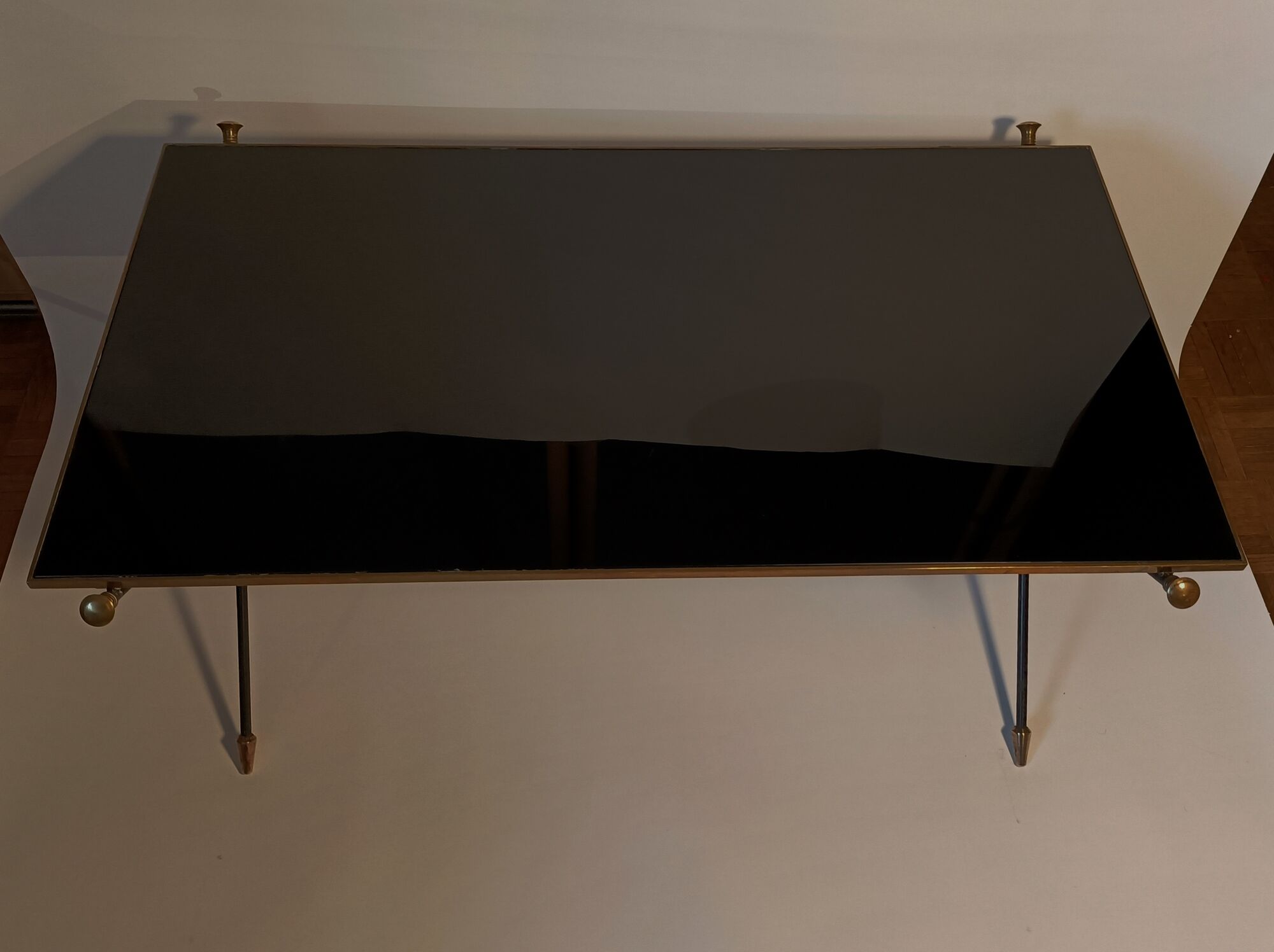 Coffee table in gilded brass, black metal and black opaline top, circa 1950
