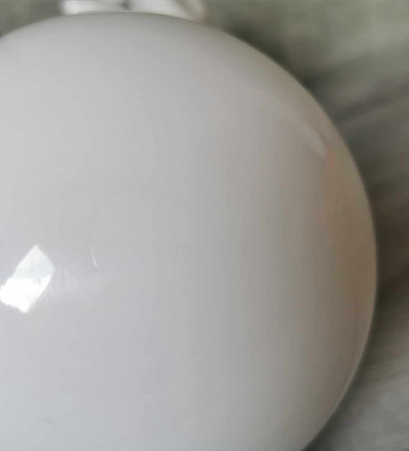 White ceramic hand wall lamp