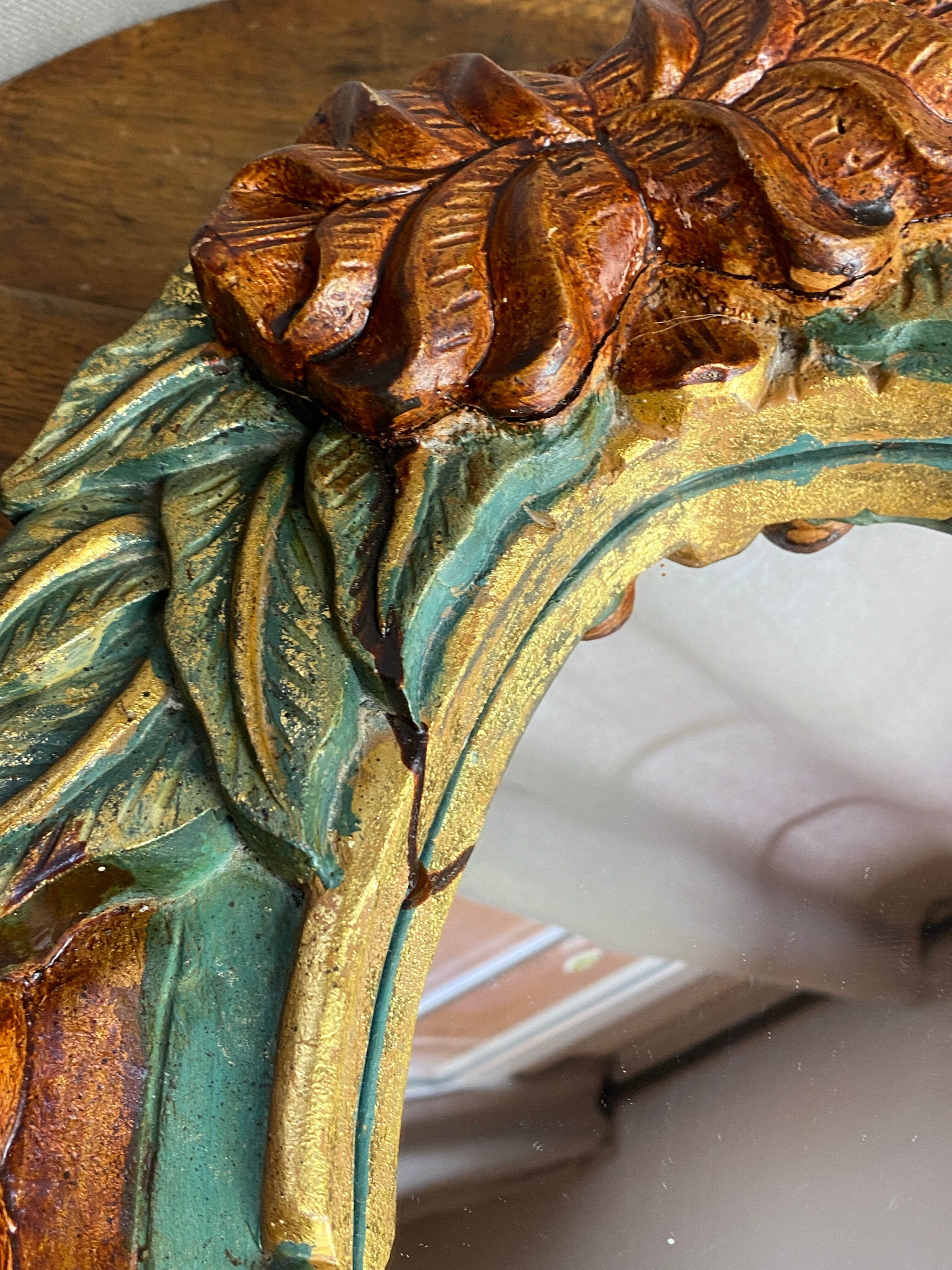 Oval mirror in carved wood