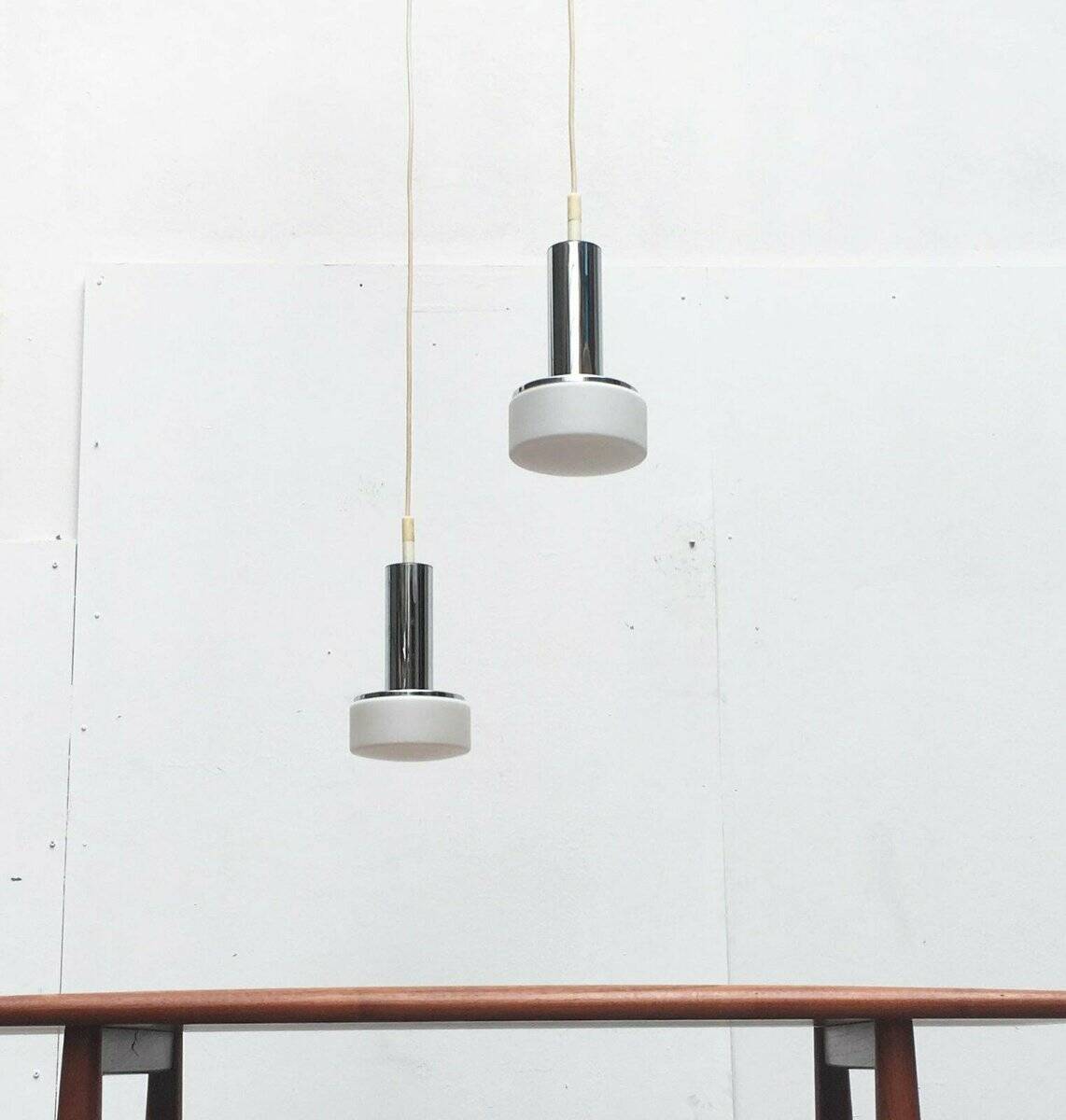 Suspended glass and chrome lamps model P105 German Mid-Century Space Age from the 1960s by Staff, set of 2.