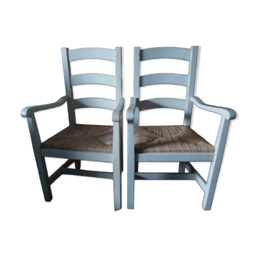 2 armchairs by the fireplace