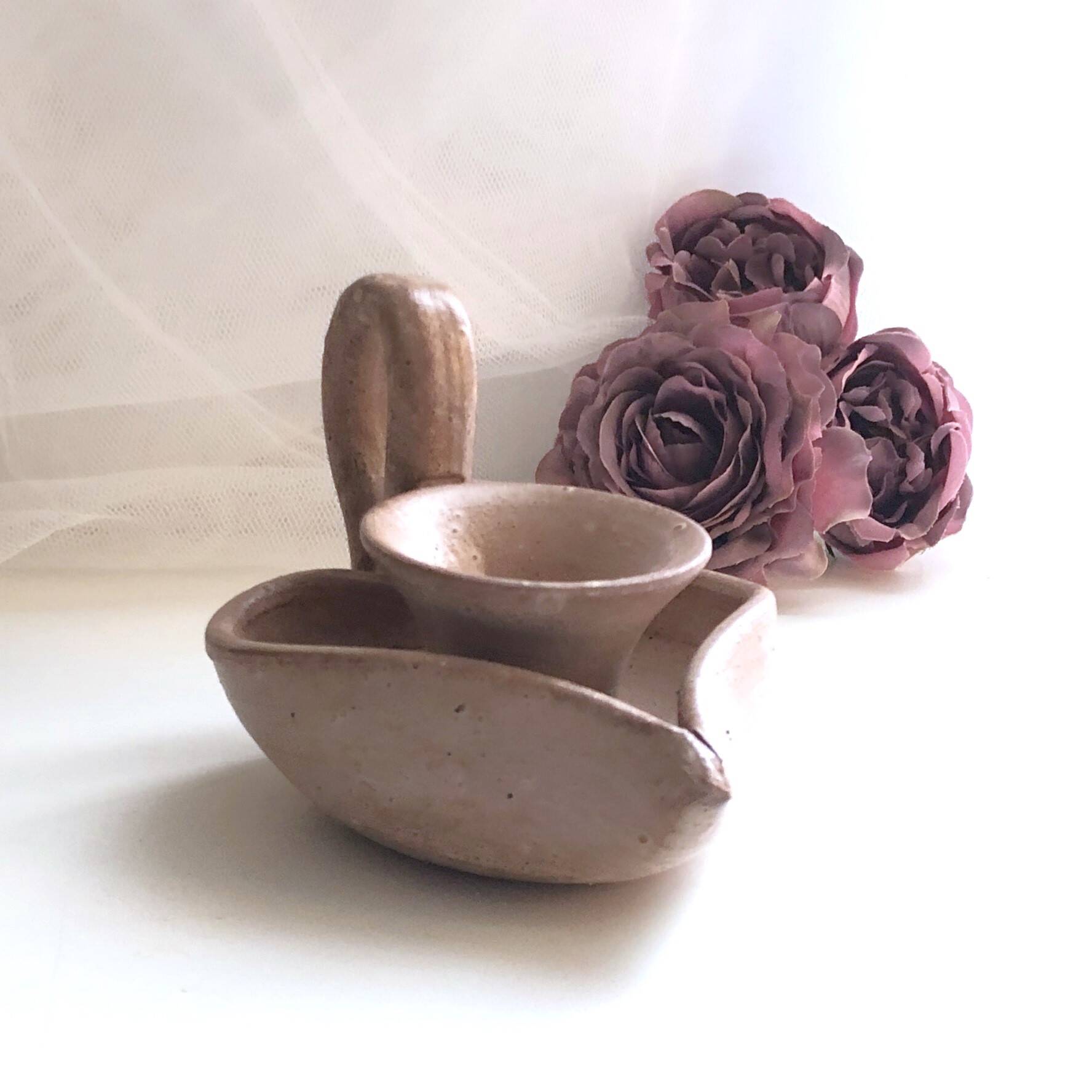Glazed stoneware heart-shaped hand candle holder