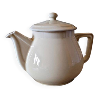 Vintage round ceramic teapot in cream colour, art deco style.