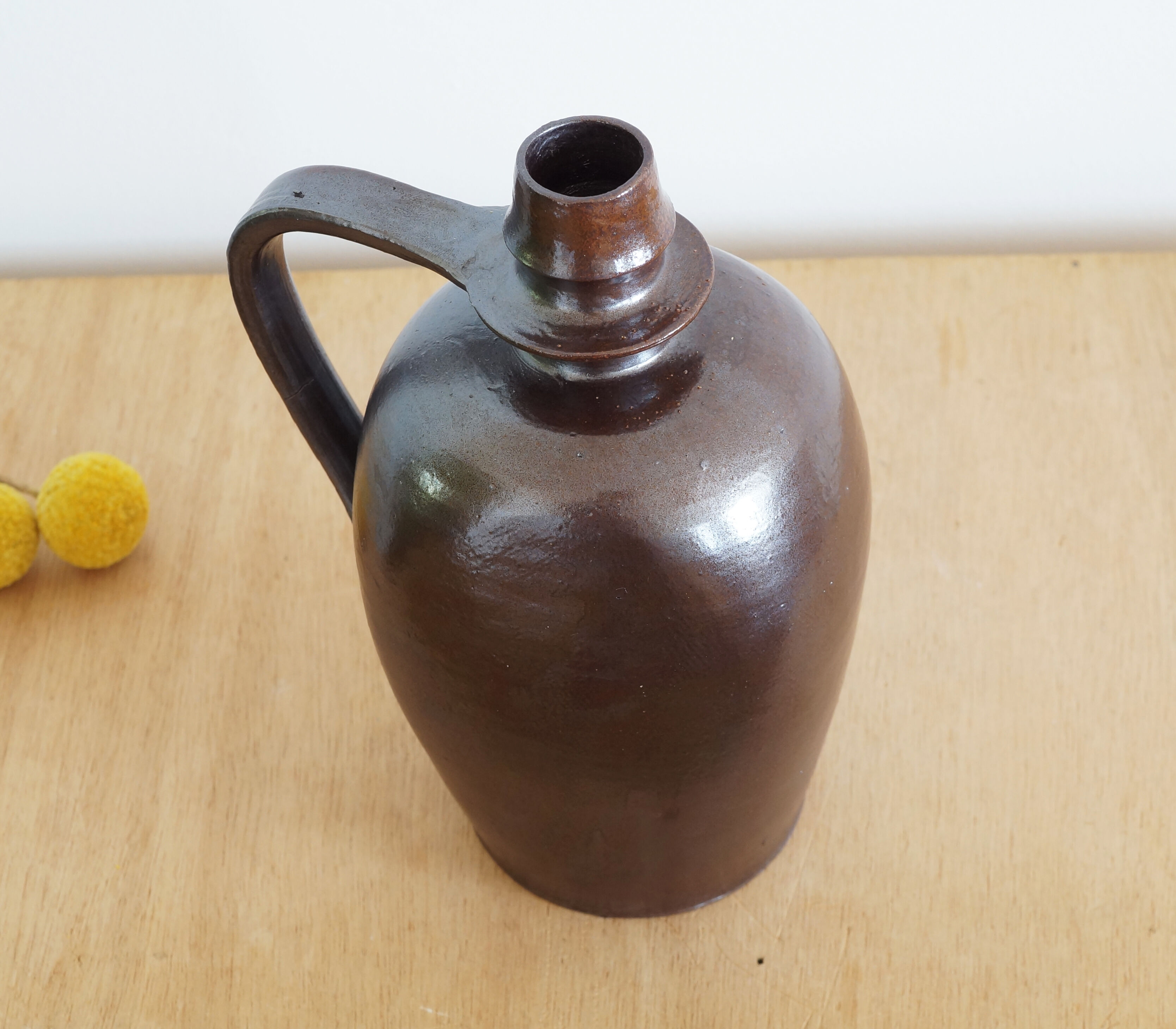 Old Norman bottle in brown ceramic