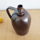 Old Norman bottle in brown ceramic
