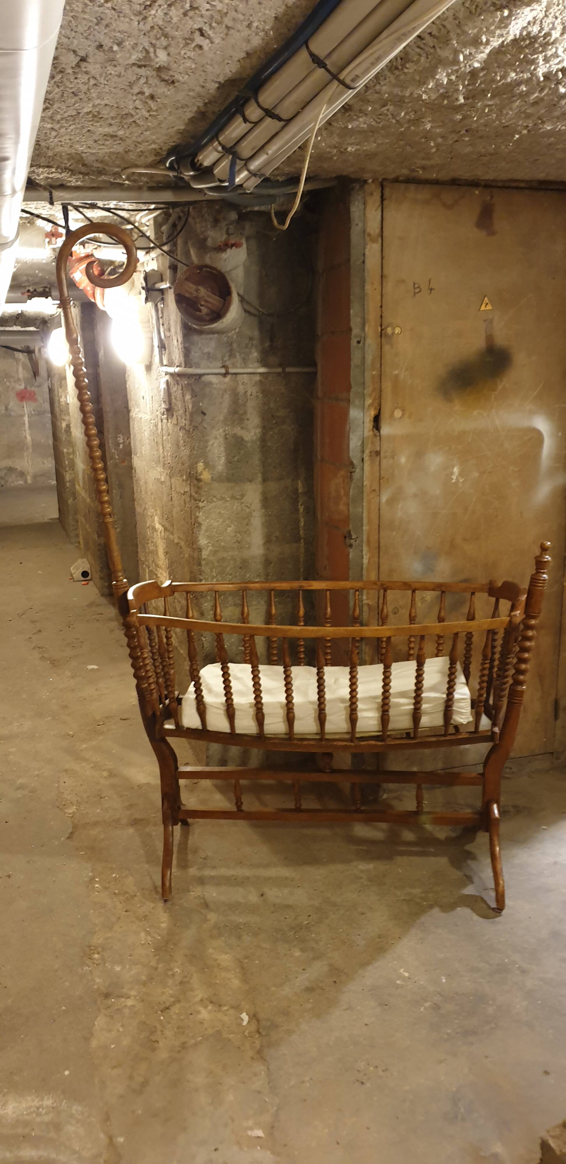 Turned wooden cradle half 20th century