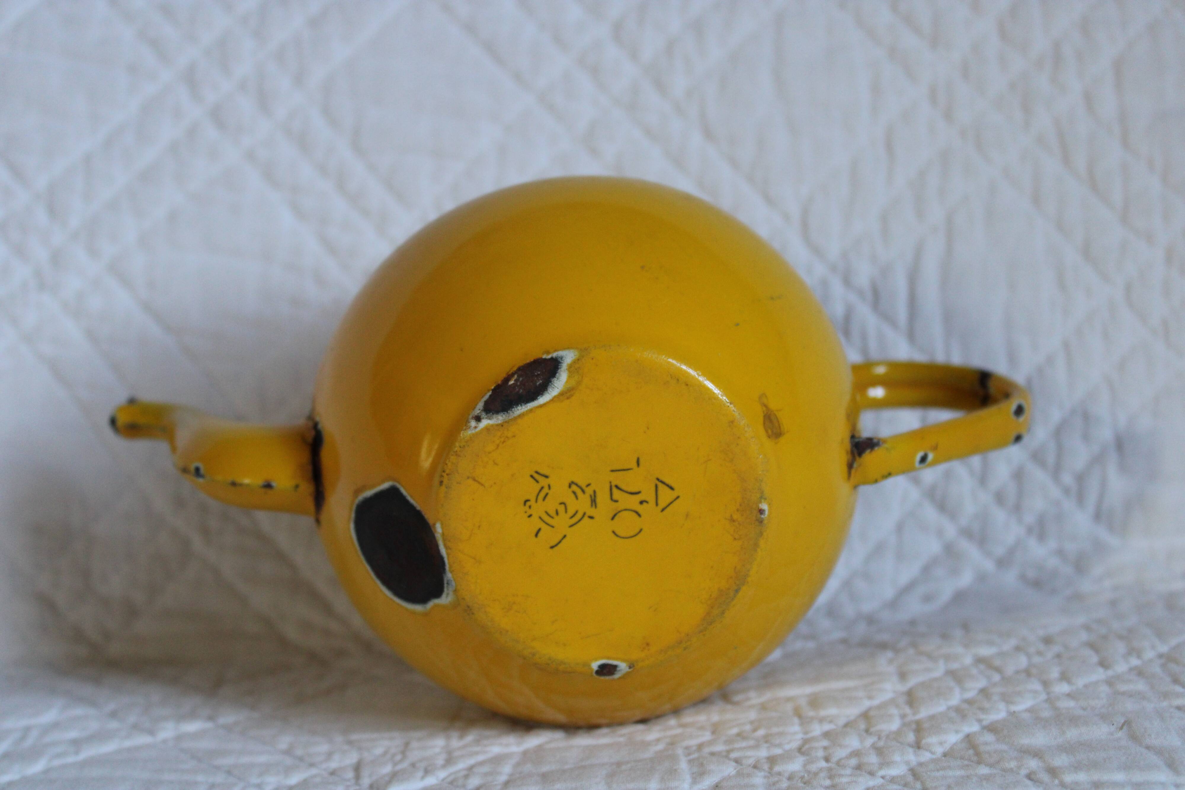 Ancient enamelled teapot