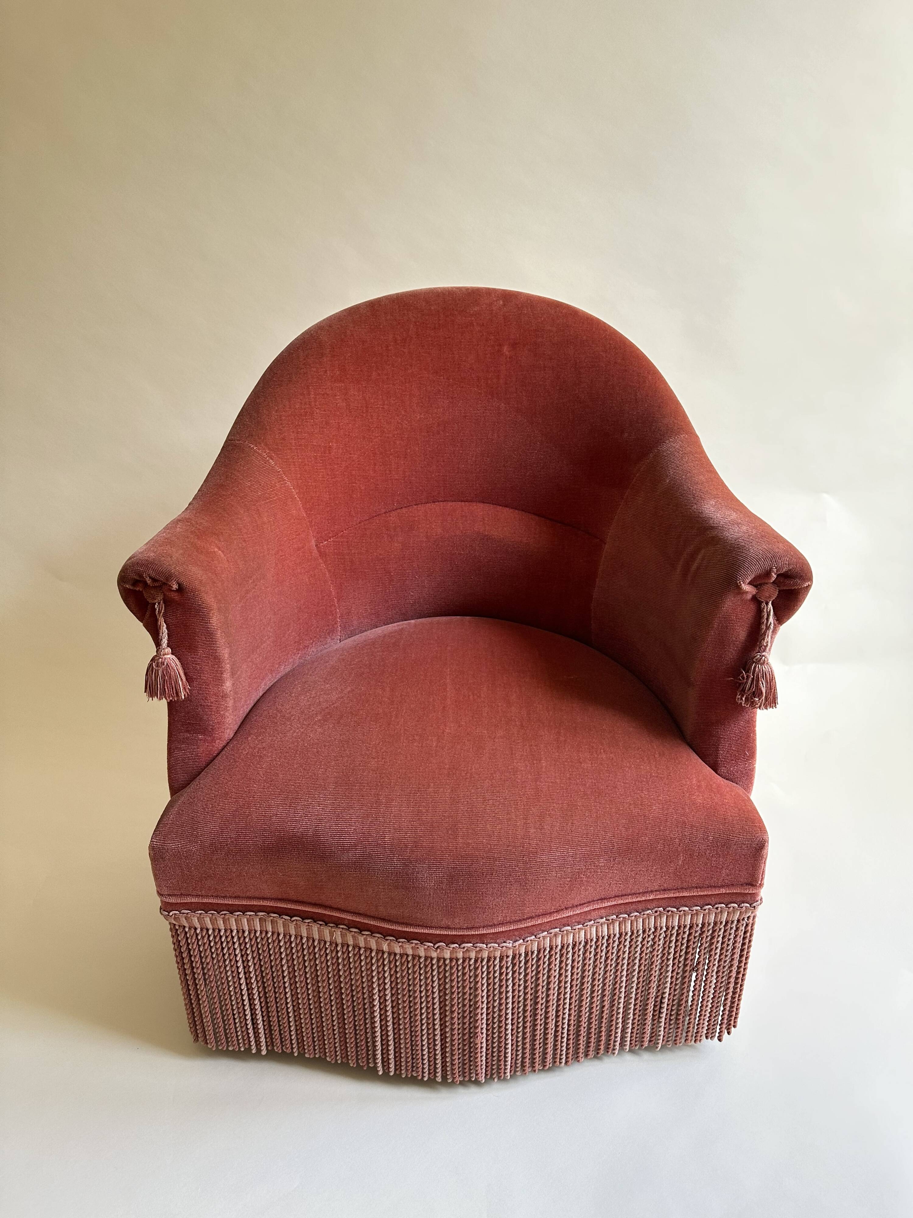 Pink-orange velvet tub chair